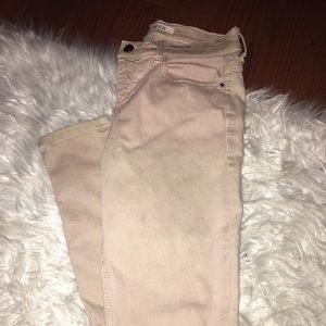 Baby pink ripped jeans